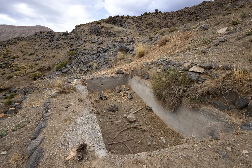 Abandoned concrete water structure on a mountain slope, a trap for animals in the range of the North African Mountain Viper, Morocco
